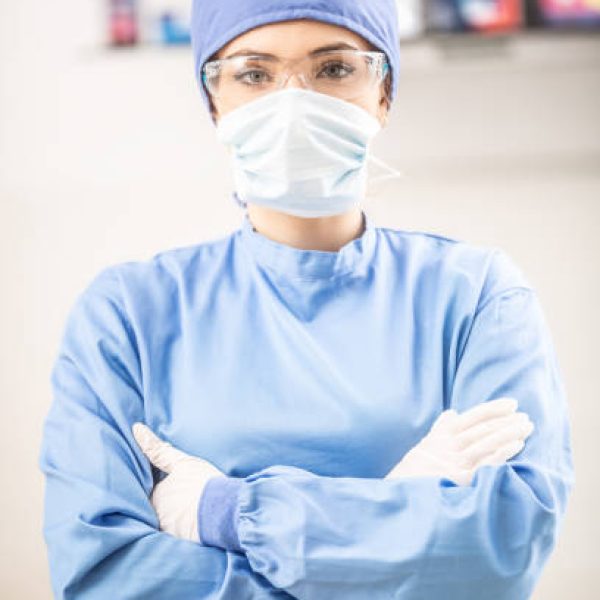 Portrait of female doctor in special surgical sterile protective clothing.